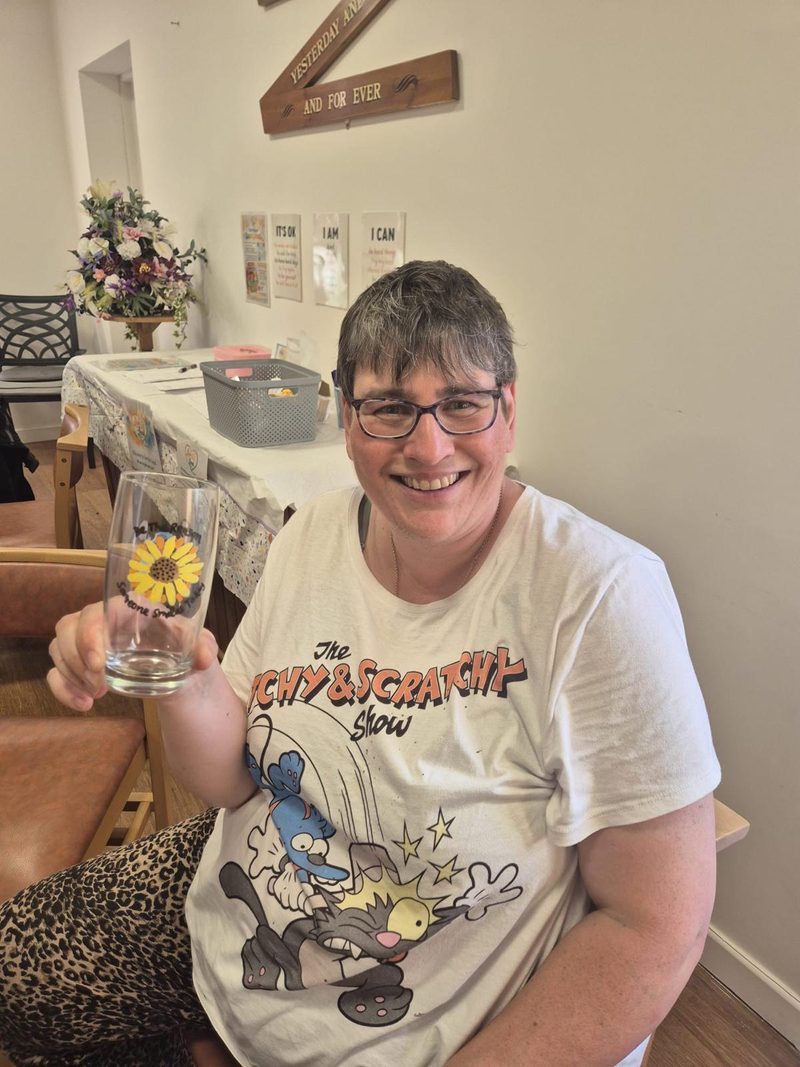 A member smiling at a group session